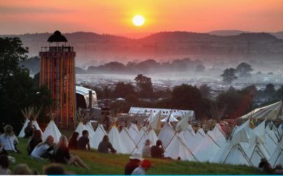 Cows, rocket cars and 5,000 toilets: the sun sets over Glastonbury festival. Photo credit: The Telegraph
